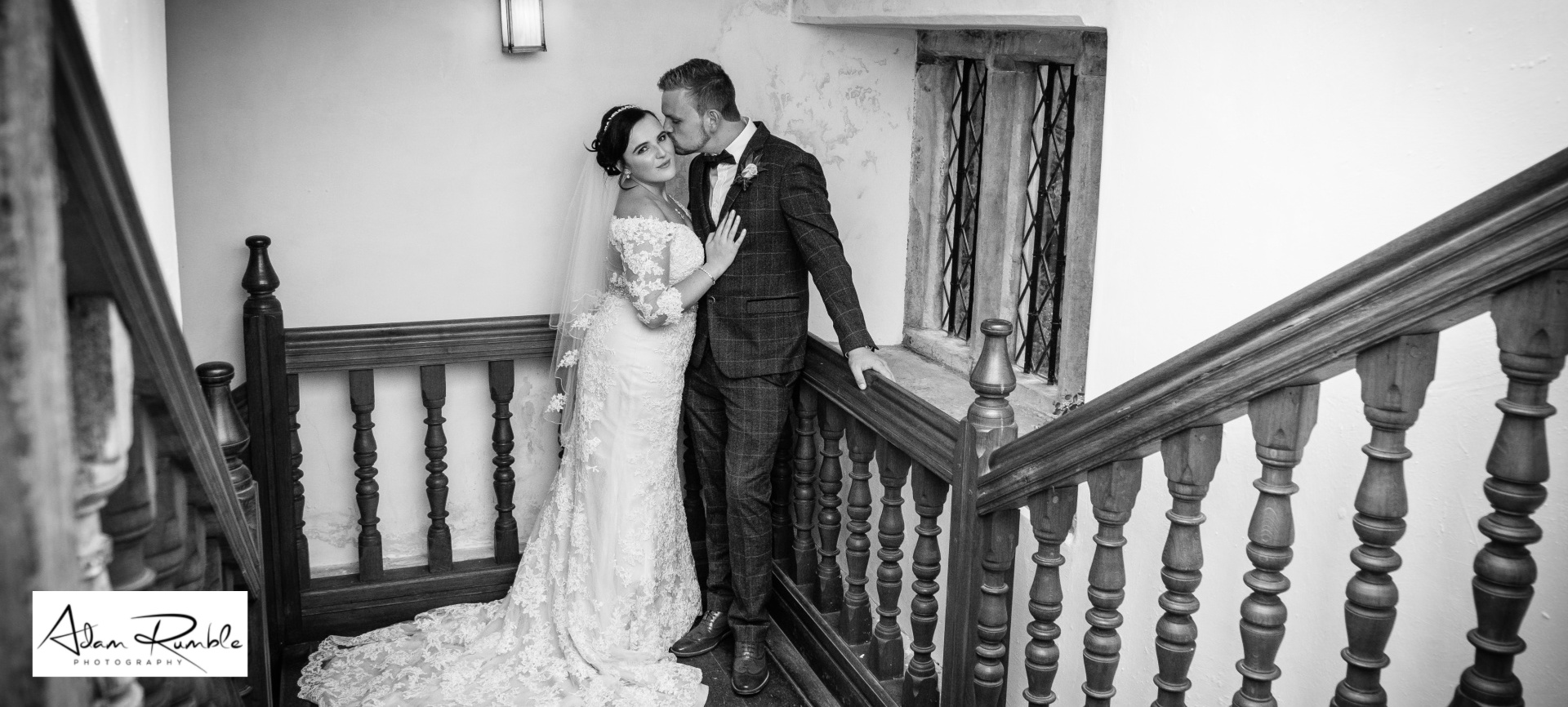 Wedding couple on grand stairs 02