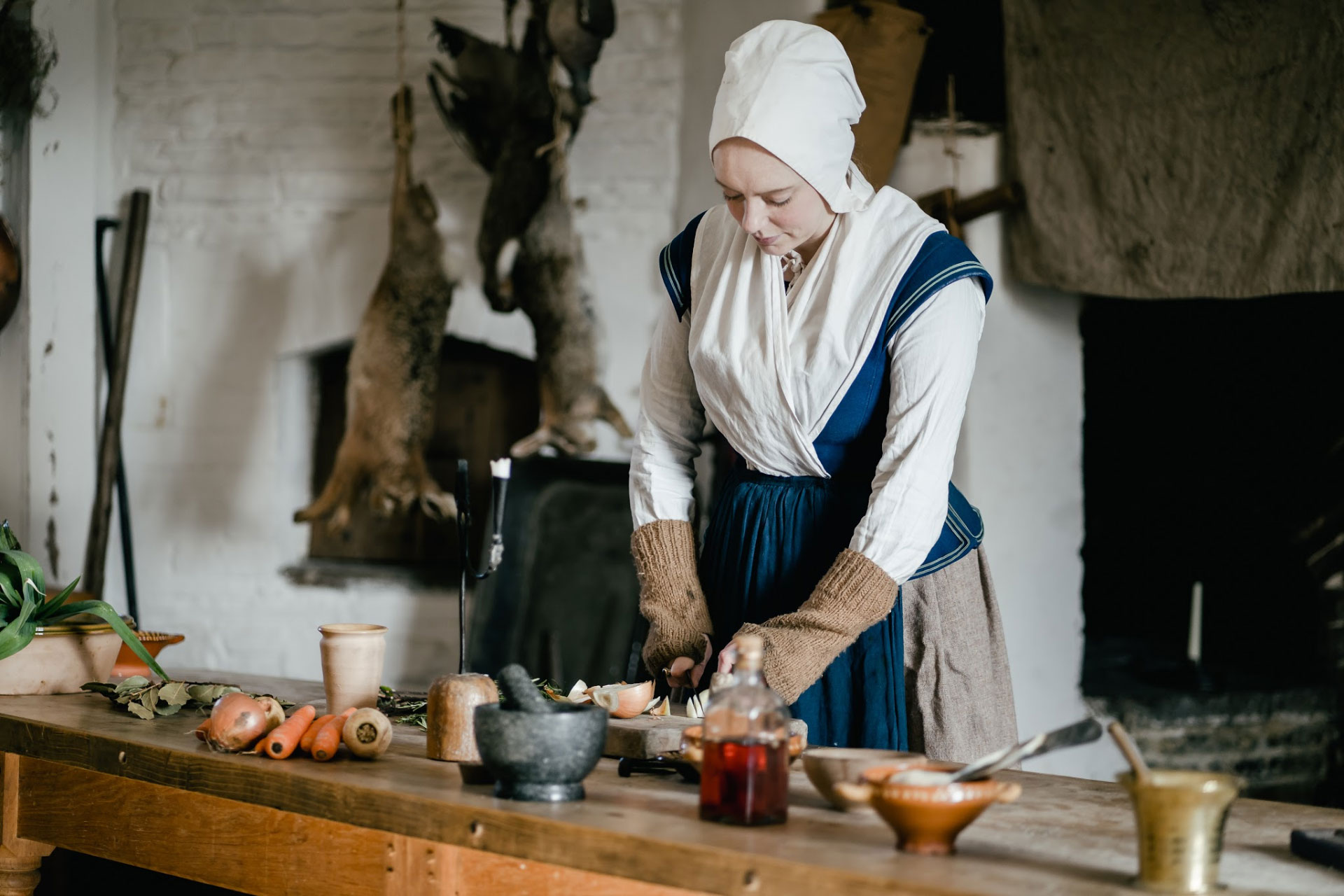 Llancaiach Fawr Manor servant in kitchen BANNER IMAGE 1920 pixels